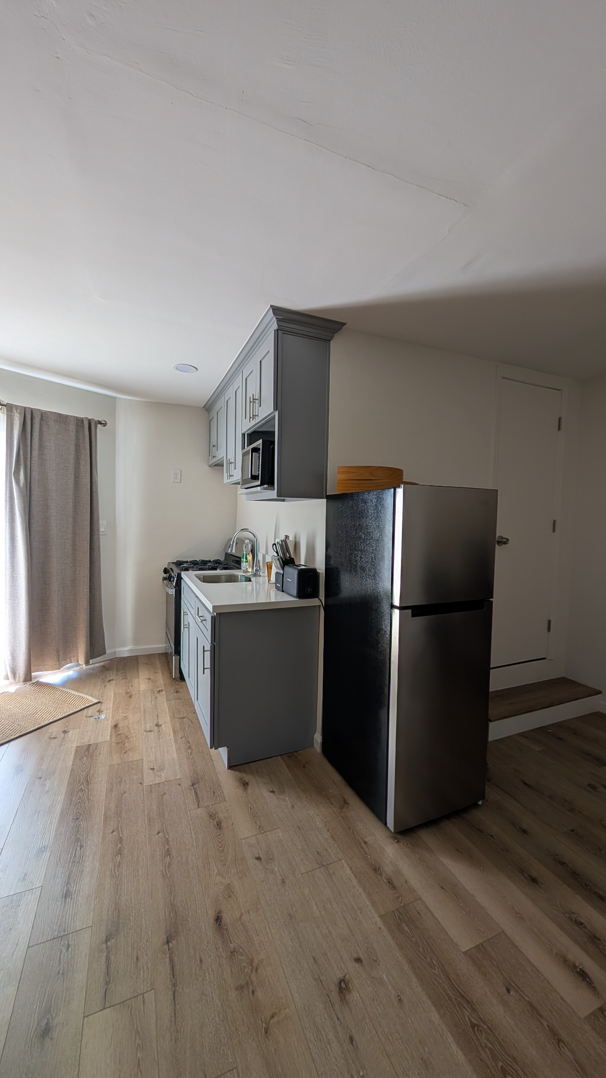 Quiet Studio Addition with Full Kitchen & Private Entrance - Utilities Included - Photo 4