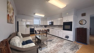 Charming 3-bedroom, 2-bath apartment with a private outdoor porch and stunning sunset views. Ideally - Photo 1
