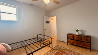 Charming 3-bedroom, 2-bath apartment with a private outdoor porch and stunning sunset views. Ideally - Photo 8