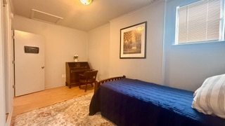 Charming 3-bedroom, 2-bath apartment with a private outdoor porch and stunning sunset views. Ideally - Photo 9
