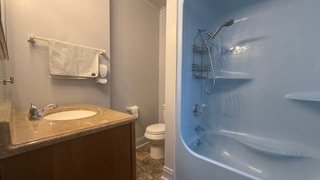 Charming 3-bedroom, 2-bath apartment with a private outdoor porch and stunning sunset views. Ideally - Photo 11