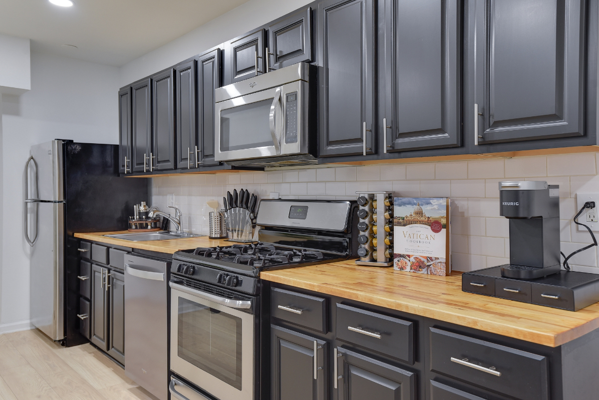 Stylish Furnished 2BR DC Condo | Workspace + In-Unit Laundry - Photo 11