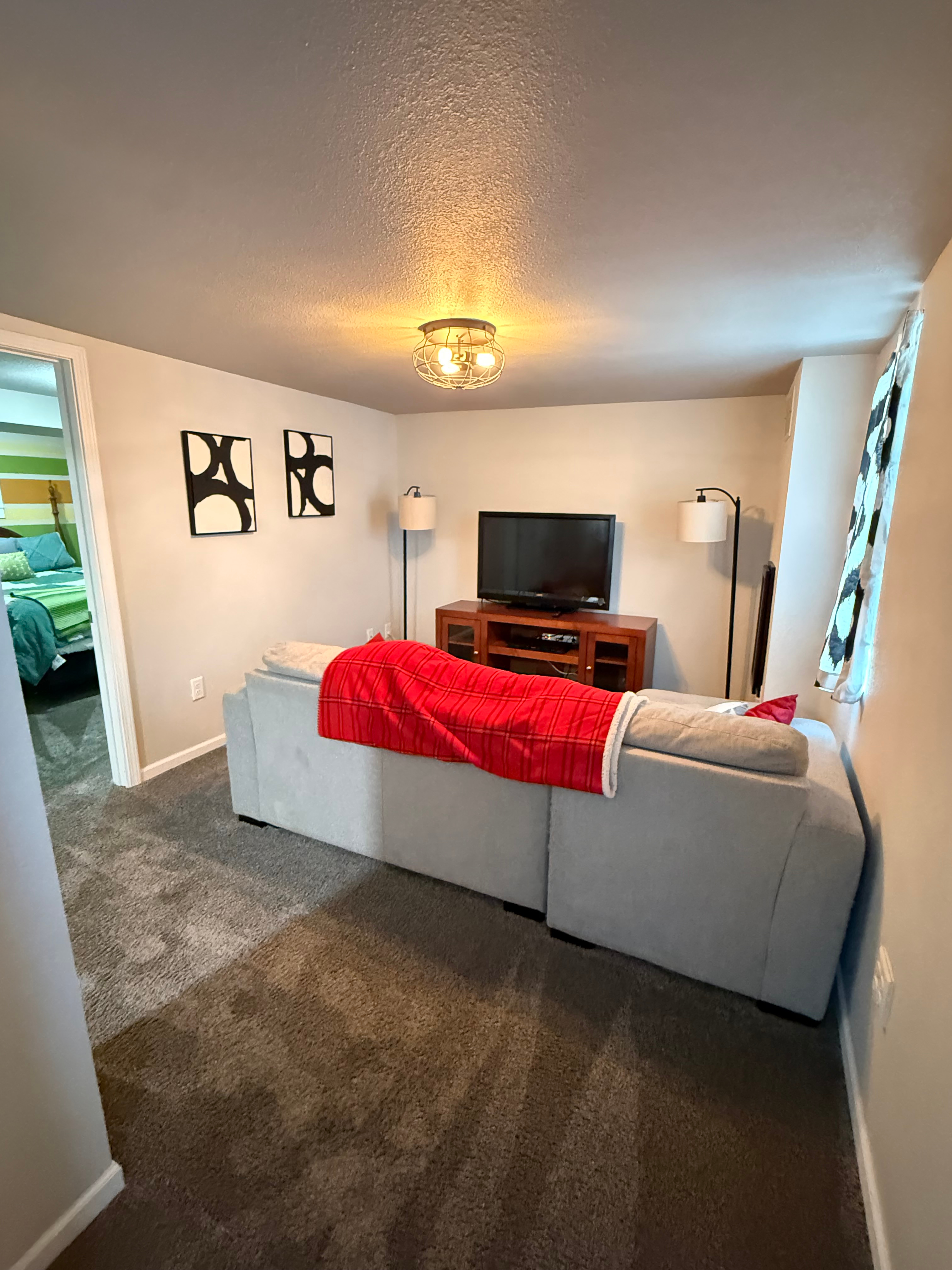Spacious 4-Bedroom Furnished Home with Fenced Backyard - Photo 9