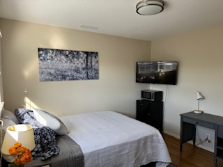 Safe, Cozy and Centrally Located Home Bedroom 1 - Photo 4