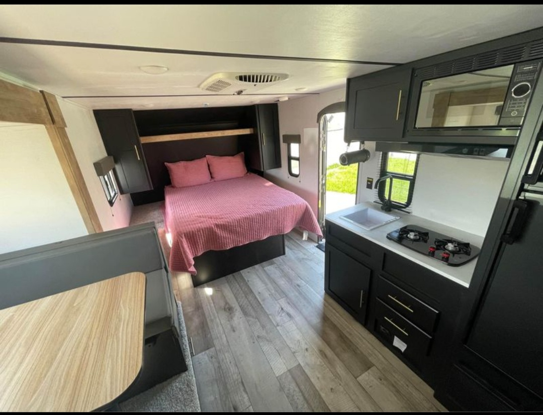 MODERN Travel trailer next to Pickleball and more