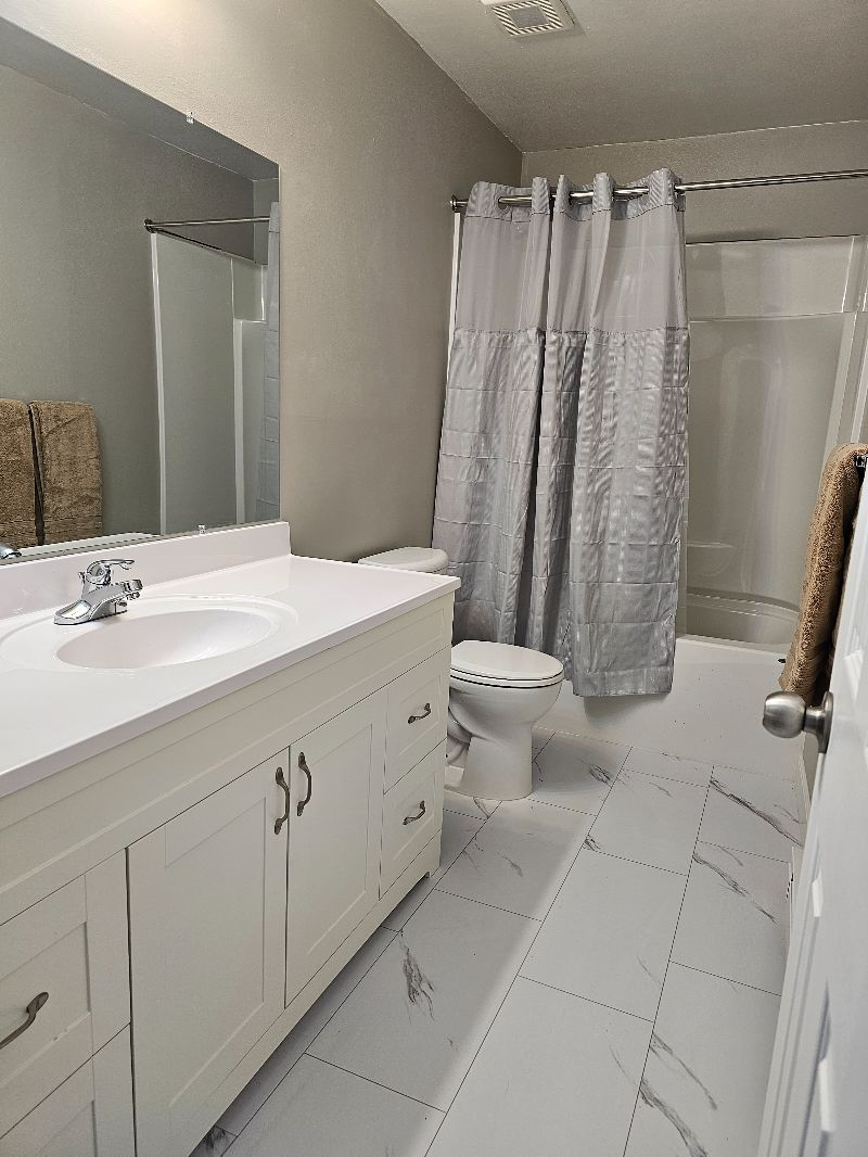 Newly Remodeled 3 Bedroom 1 Bath Upper Unit Fully Furnished with Designated off street Parking - Photo 2