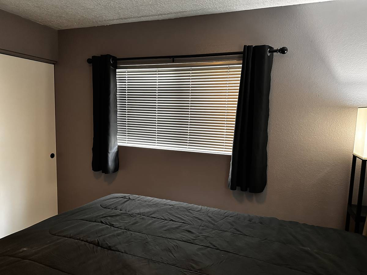 Furnished bedroom with lots of storage