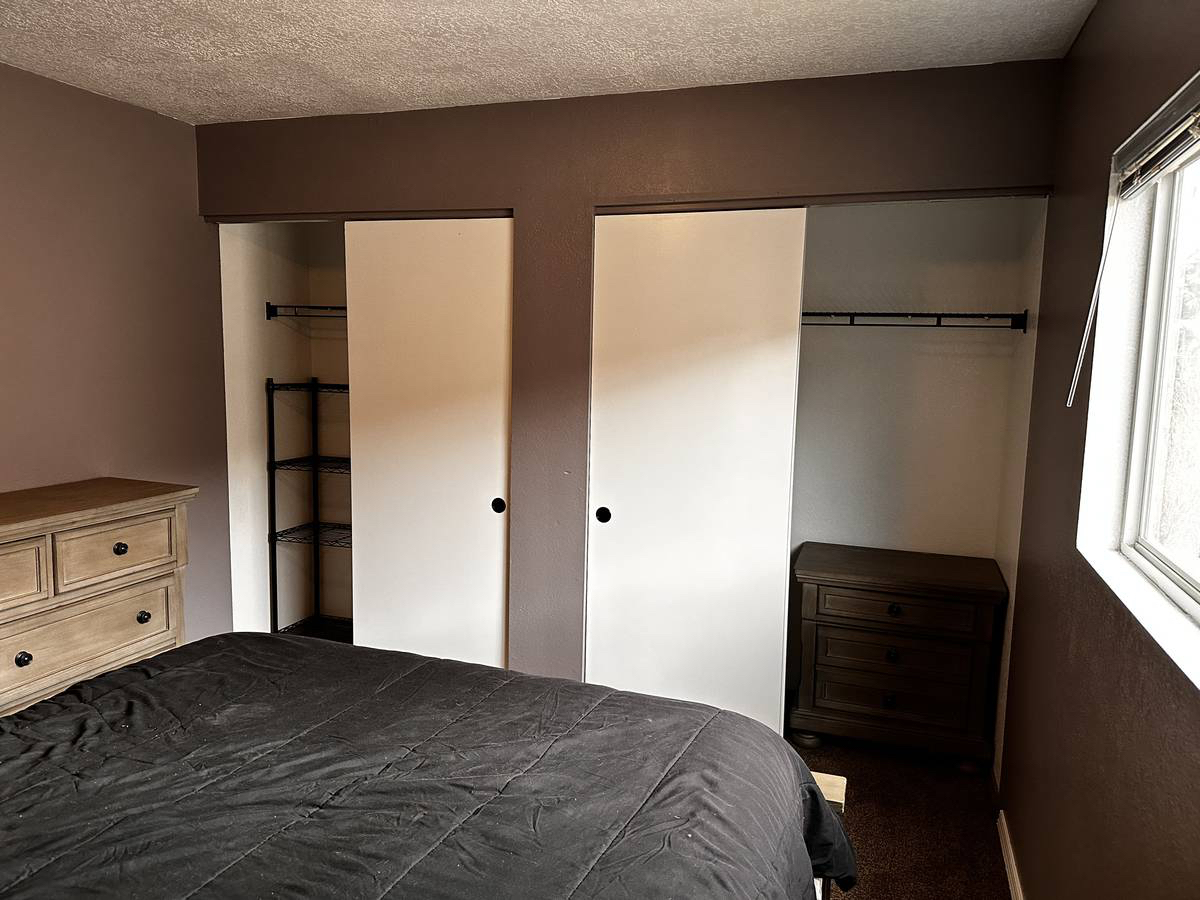 Furnished bedroom with lots of storage - Photo 3