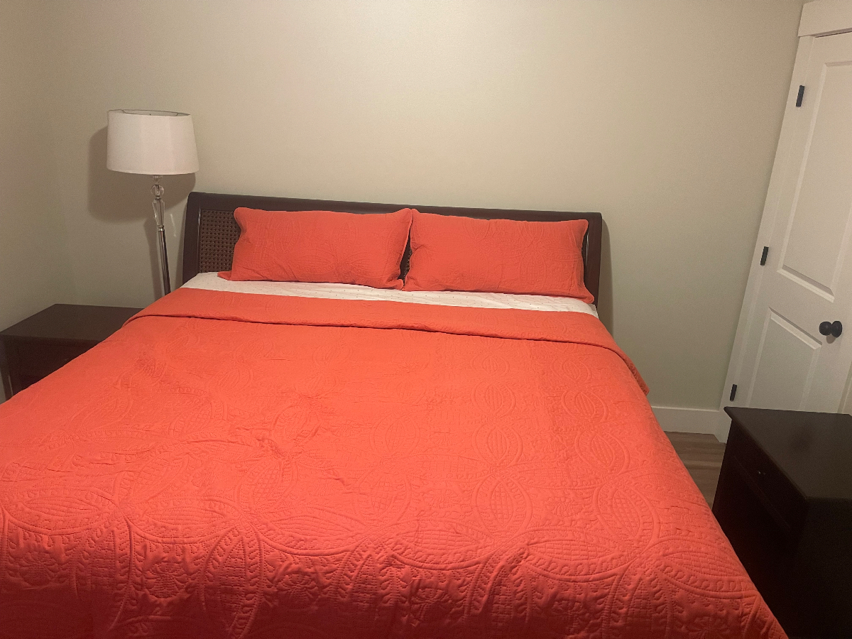 A beautiful master bedroom with a 75'' smart TV, a dresser, king size bed, air-conditioning in a new - Photo 8