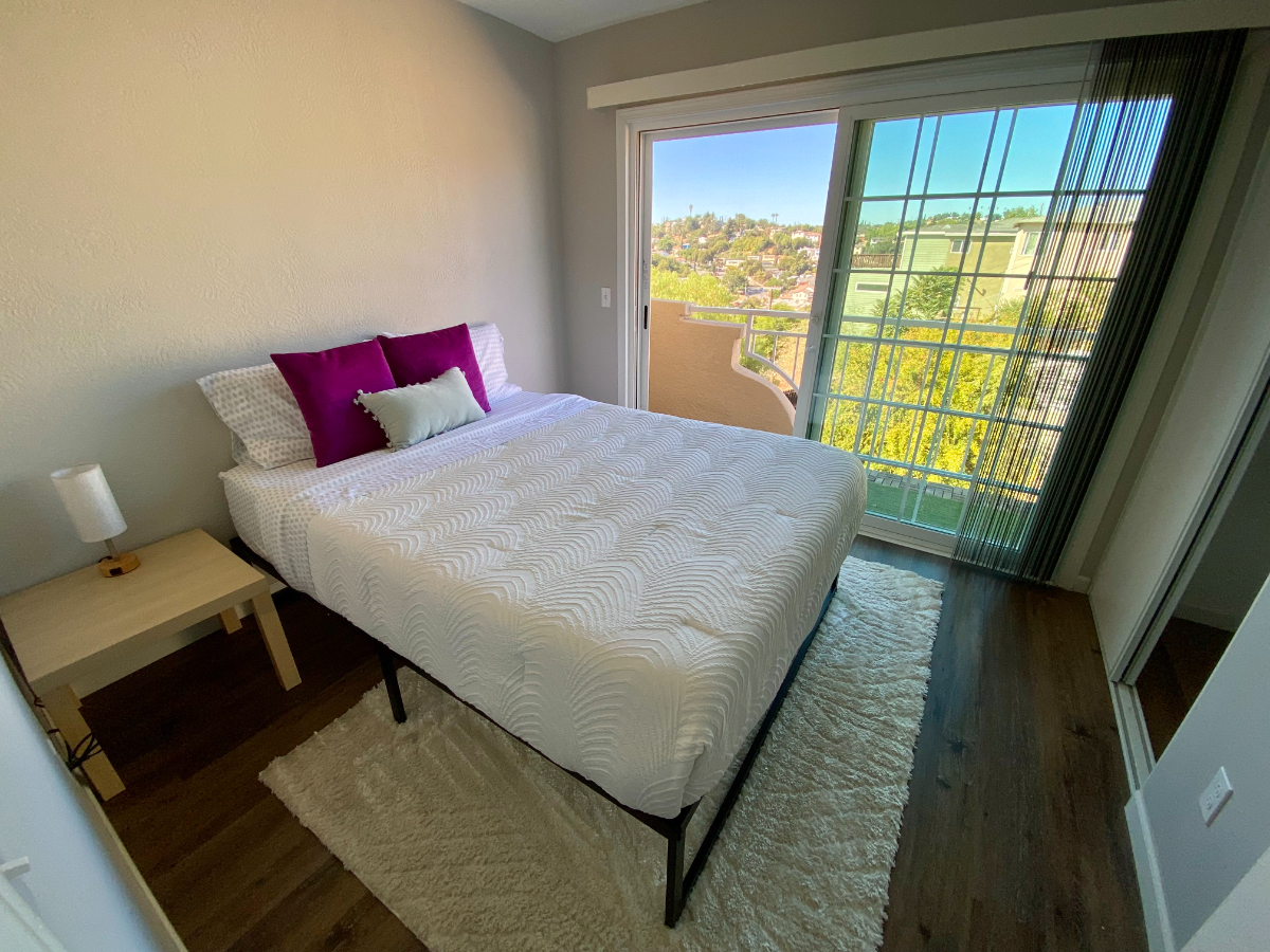 Serene Bedroom in a Condo with Modern Luxuries and Prime Location in Gated LA Community - Photo 1