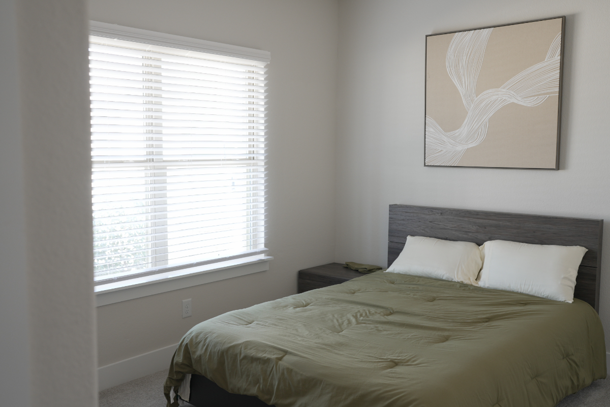 Inviting Queen Size Bedroom with Shared Bathroom