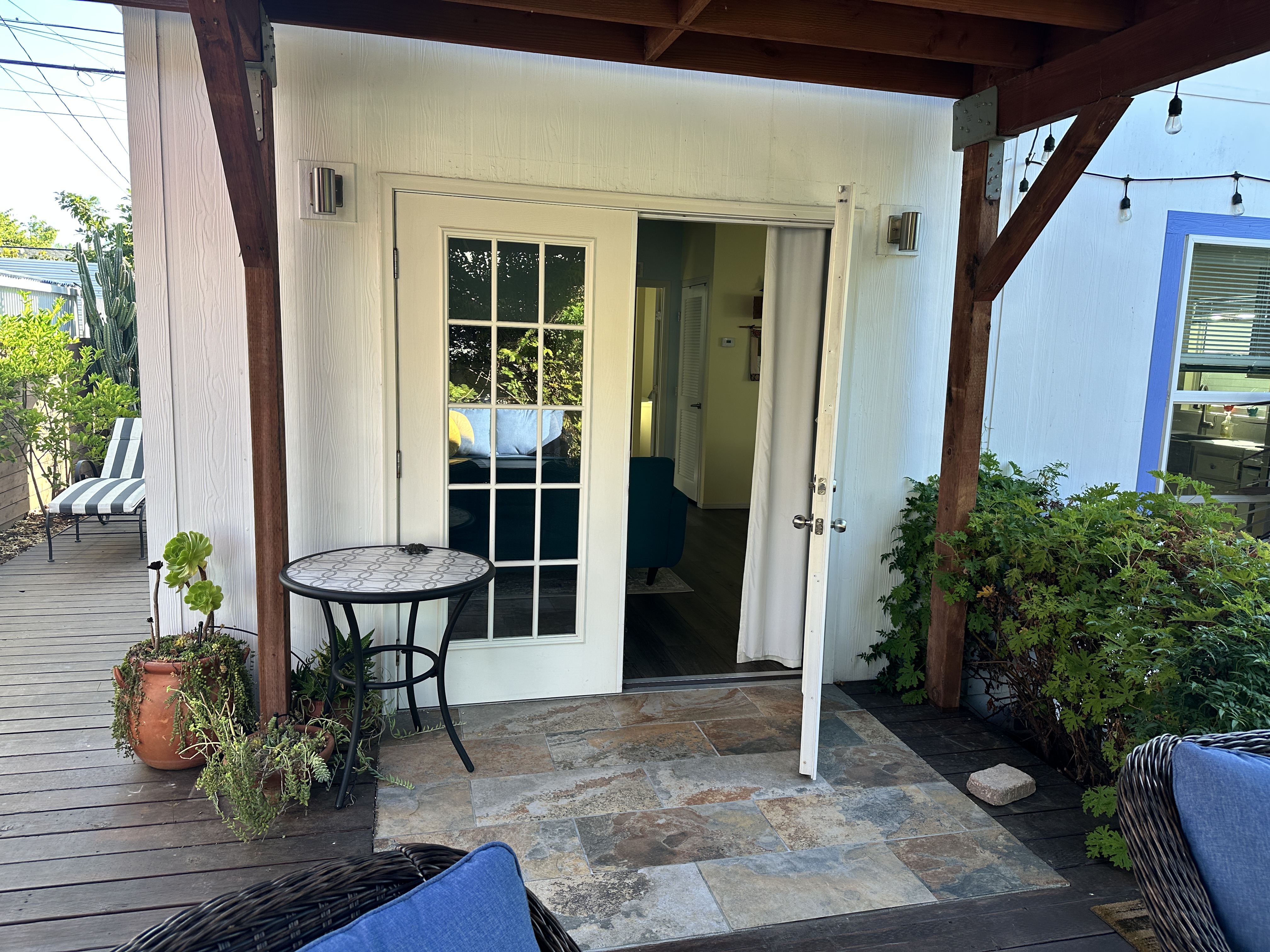 King-size one-bedroom home with covered deck, patio, fruit trees and greenery. Very private. - Photo 4