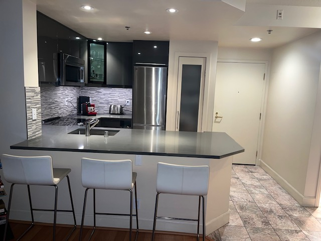 Stylish 1BR Condo with Luxury Amenities, Serene Views & Prime Location - Photo 5