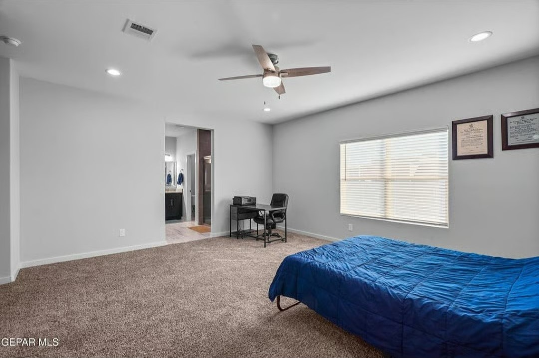 Spacious Master Bedroom Retreat with Modern Amenit