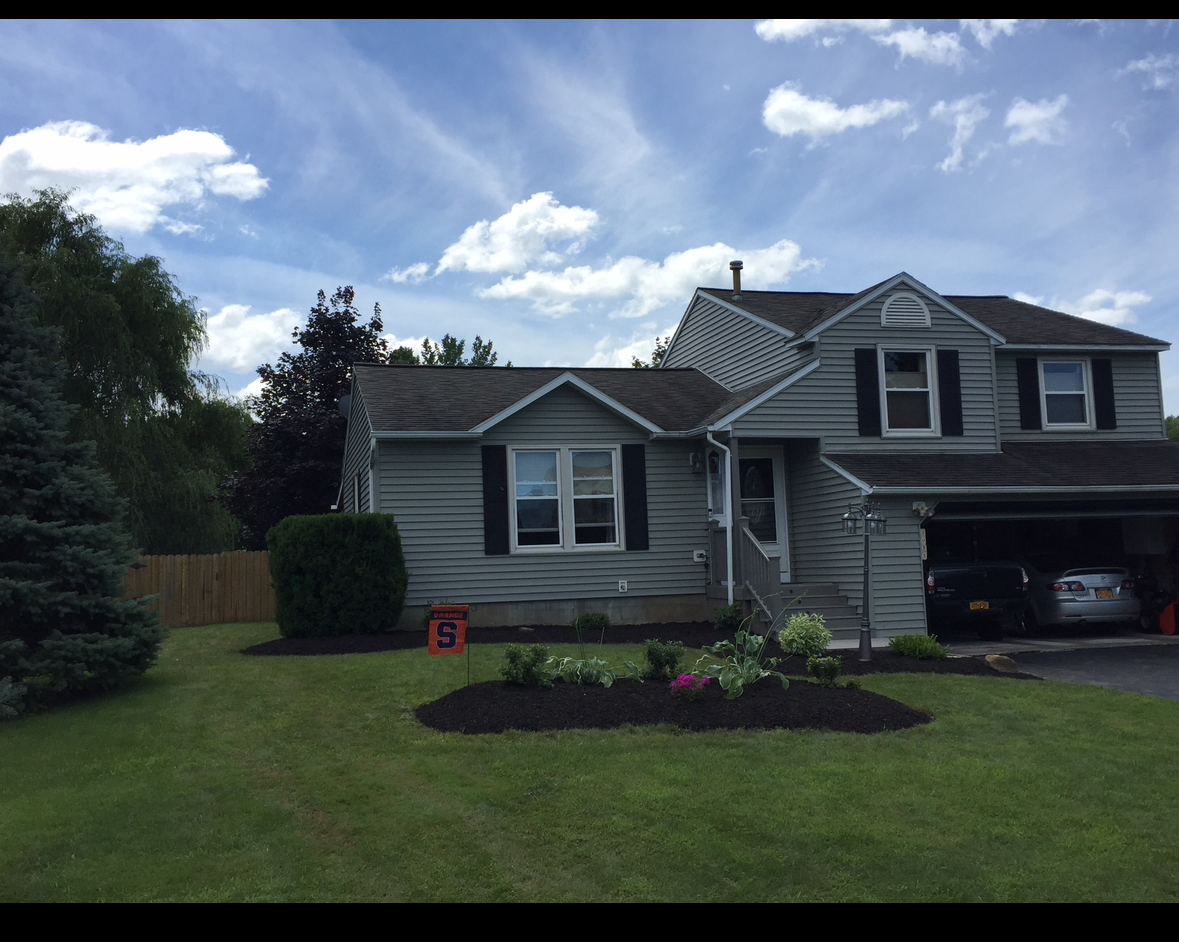 Exquisite 3BR Split-Level Home with Luxury Amenities And Lush Outdoor Paradise - Photo 2