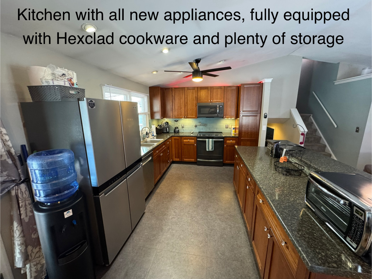 Exquisite 3BR Split-Level Home with Luxury Amenities And Lush Outdoor Paradise - Photo 5
