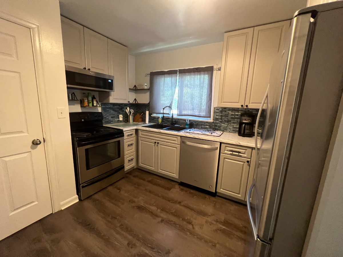 Delightful 2-Bedroom Home with Modern Kitchen, Cozy Living Space, and Private Fenced Yard - Photo 9