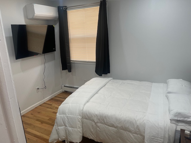 Charming Bedroom In Spacious Apartment with Modern Features, Fully Furnished & Utilities Included Room 1