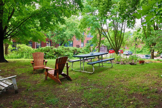 Primary Furnished Bedroom in 2 Bedroom Unit, wood floors, lots of closet space, off-street parking! - Photo 12