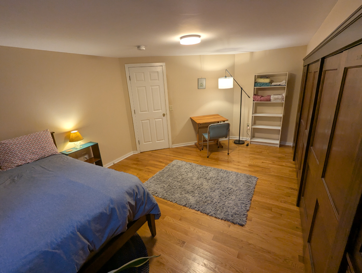 Primary Furnished Bedroom in 2 Bedroom Unit, wood floors, lots of closet space, off-street parking! - Photo 3