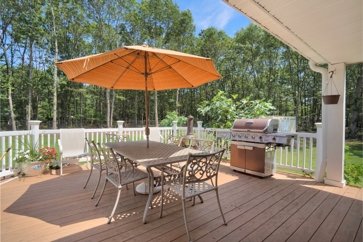Manorville 4BR | Fenced Yard, Deck, Fireplace - Photo 1