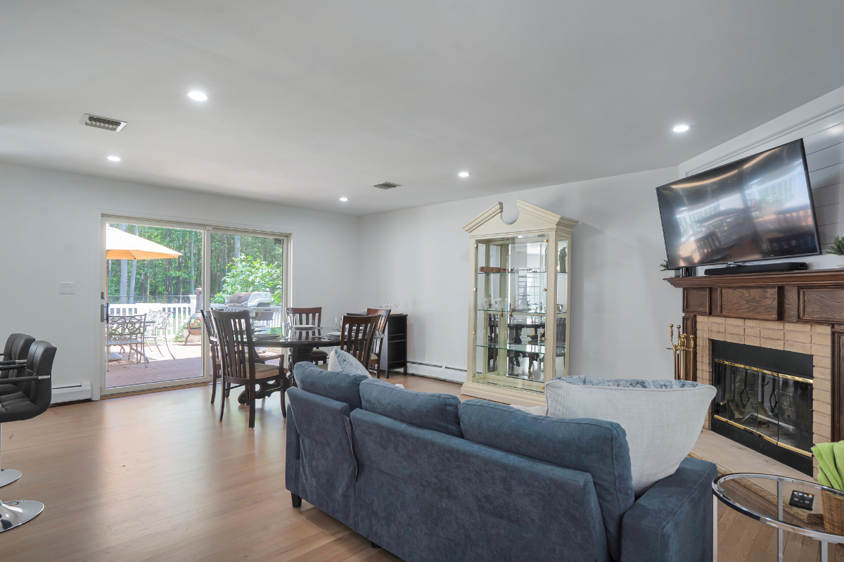 Manorville 4BR | Fenced Yard, Deck, Fireplace - Photo 4