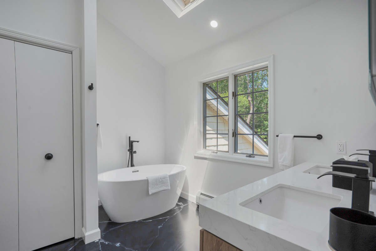 Manorville 4BR | Fenced Yard, Deck, Fireplace - Photo 11