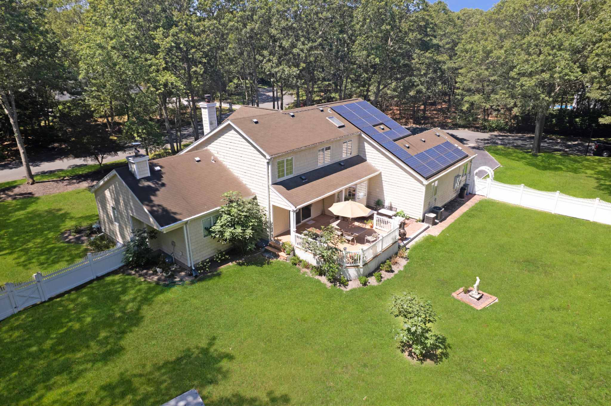 Manorville 4BR | Fenced Yard, Deck, Fireplace - Photo 3