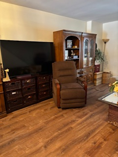 Comfortable end unit two-bedroom condo with garage, sunroom, and community pool access - Photo 3