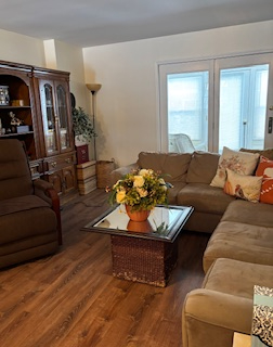 Comfortable end unit two-bedroom condo with garage, sunroom, and community pool access - Photo 4