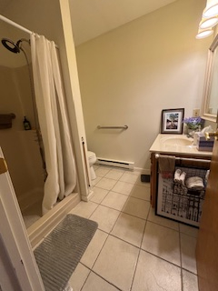 Comfortable end unit two-bedroom condo with garage, sunroom, and community pool access - Photo 6